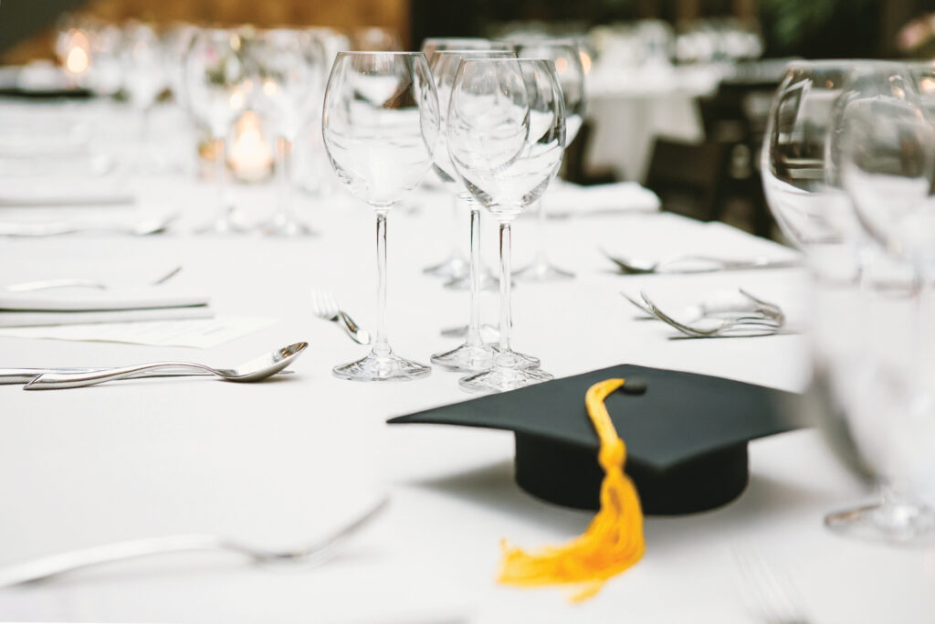 A graduation cap on a set table