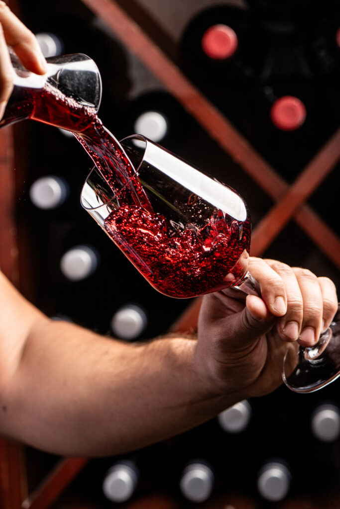 Wine pouring from a carafe into a glass